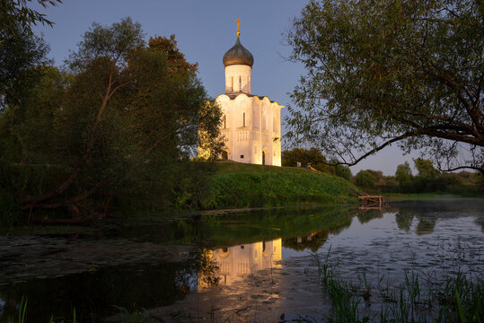The ancient Church of the Intercession on the Nerl with a reflection in the evening lighting. Bogolyubovo, Vladimir region. Golden ring of Russia