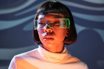 Woman exploring with futuristic virtual reality glasses