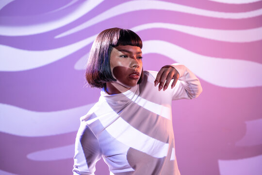 Futuristic latin woman exploring virtual reality