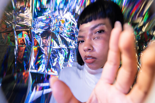 Futuristic latin woman exploring the vibrant metaverse