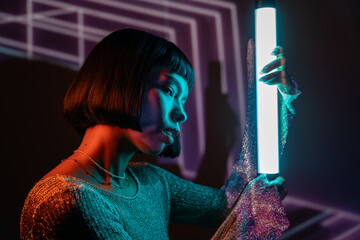 Futuristic woman in glowing metaverse environment