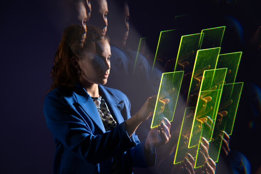 Young woman interacting with futuristic technology