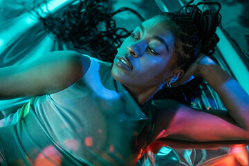 Futuristic african woman in a vibrant metaverse setting