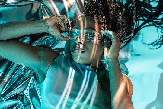 Futuristic metaverse vision with young African woman