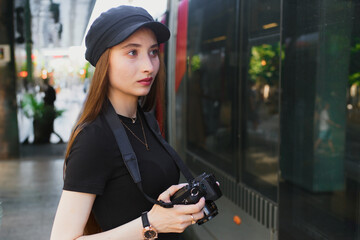Woman photographer capturing city life moments