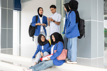 Asian students gathering at school entrance