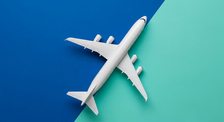 White airplane model on blue and green background, showcasing travel and journey concept, ideal for travel agency or tourism banner