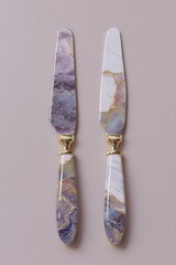3D Render of a Decorative Butter Knife Set with Marble Texture