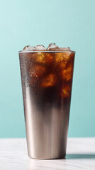 Cold brew coffee chills in metal tumbler. Perfect for summer marketing, food blogs, and design projects.