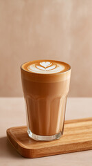 Latte art showcases heart design in glass. Wooden tray supports the drink, perfect for blog, marketing, or web use.