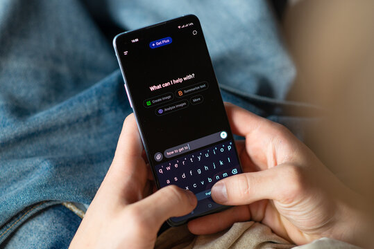 Kyiv, Ukraine - July 28, 2025: Close-up of hands holding phone with ChatGPT artificial intelligence chatbot on screen.