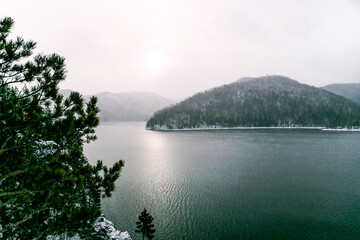 Krasnoyarsk Reservoir on Yenisei River, winter landscape on cloudy day Siberia