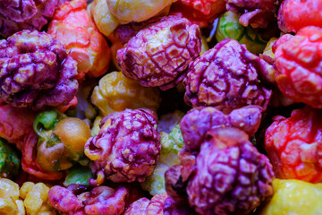 A vibrant, close-up of colorful sweet popcorn kernels