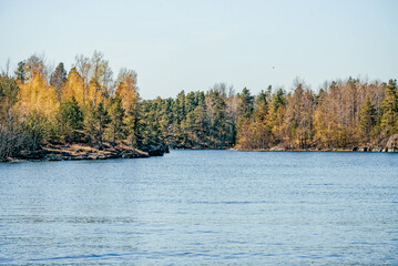 Landscape blue deep lake light sun, clouds sky mountains Ladoga skerries Karelia