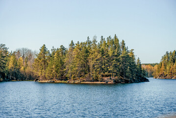 Landscape blue deep lake light sun, clouds sky mountains Ladoga skerries Karelia