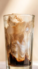Affogato coffee with melting vanilla ice cream in a glass. Delicious Italian dessert or beverage for cafe menu design.