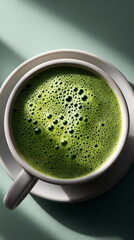 Mug with green tea. Hot matcha latte drink in cup. Healthy beverage and breakfast concept with copy space.