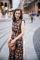 Fototapeta premium Young woman smiling in piazza de ferrari, genoa, italy