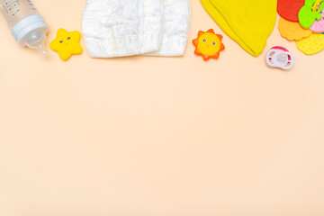 Baby diapers,bodysuit,hat,toys,teethers,nipples,milk bottle.Set of kids,childrens clothes and accessories.newborn,infant fashion,outfit. Flat lay, top view.