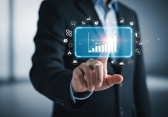 Businessman interacts with a futuristic digital interface displaying a rising bar graph and various business icons
