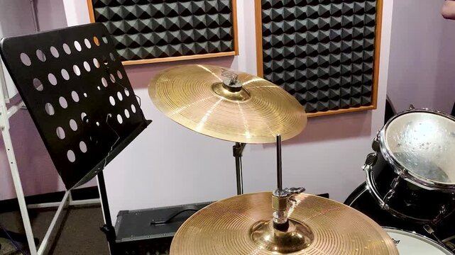 Drum set in the wall acoustics recording studio .Drums with high-hats on the background of soundproofing wall acoustics recording studio