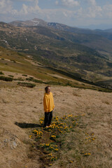 Woman in Yellow Jacket Hiking in Carpathian Mountains