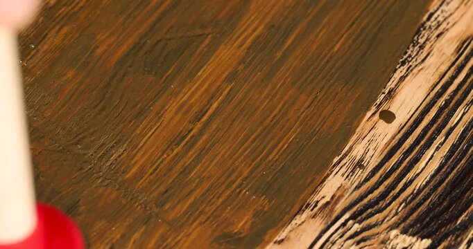 brown oil for the treatment and protection of wood by staining, linseed oil for painting wood for a beautiful appearance and protecting the tree from the sun and pests