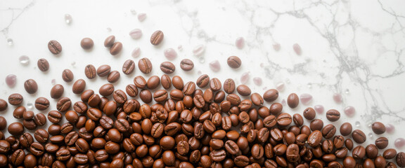 A top-down view of roasted coffee beans scattered on a white marble surface with decorative elements, perfect for cafe branding and food-related projects.