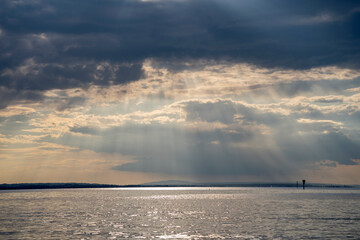 dark clouds pushing away the sunny weather, over Lake Constance seen from Höchst Vorarlberg