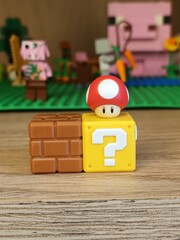Fototapeta premium Super Mario Mushroom and Question Block with Minecraft Background