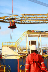 Crews boat moving the passenger and cargo from the platform to supply boat in oil and gas industry. Support offshore oil and gas industry by boat and service team.