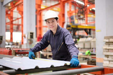 Technician or worker checking metal sheet in the factory