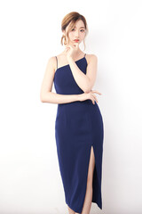Beautiful face of young Asian woman in sexy dress Blue Perfect slim body on white background, plastic surgery and aesthetic cosmetology, Facial and skin care concept