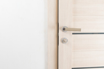 white wall and light door during installation and assembly of interior lock