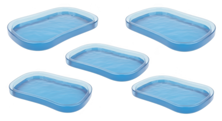 Five translucent water-filled trays arranged isolated on white creating a pattern suitable for design or conceptual imagery
