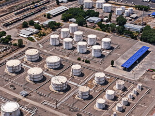 An oil depot with large tanks of various fuels. The view from the drone.