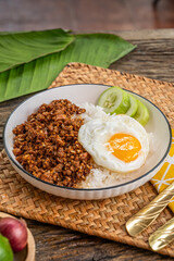 The Stir fried garlic pepper pork and fried egg  image for  Thai food concept.