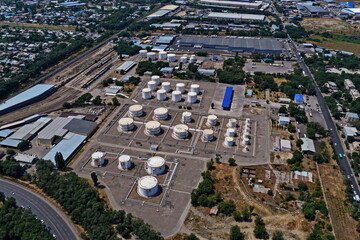 An oil depot with large tanks of various fuels. The view from the drone.
