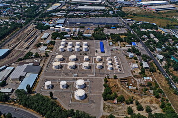 An oil depot with large tanks of various fuels. The view from the drone.