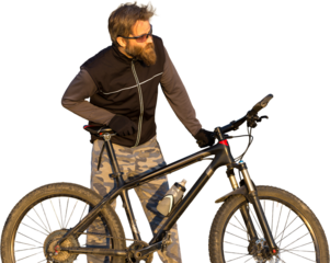 Sports brutal bearded guy on a modern mountain bike. Cyclist on the green hills in the spring.