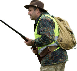 Hunting period, autumn season open. A hunter with a gun in his hands in hunting clothes in the...