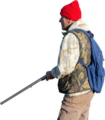 Mature hunter man holding a shotgun and walking through a field