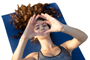 A young slim athletic girl in sportswear with snakeskin prints performs a set of exercises. Fitness and healthy lifestyle.