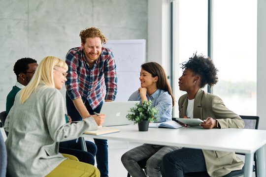 Group of young business people having a meeting or presentation and seminar in the office. Portrait of a young business man using a laptop