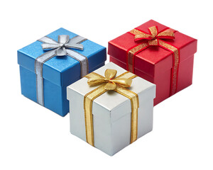 Fototapeta premium A close up of three gift boxes with ribbons in blue red and silver on a white background surface