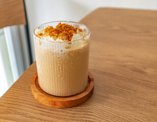 Cold coffee drink frappe frappuccino , with whipped cream and caramel crumble. Salted caramel...