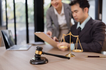 Lawyer with Document Paper and Hammer on Wood table,  Judge's Gavel, Law, Justice Symbol, Agreement and Partnership Concept,