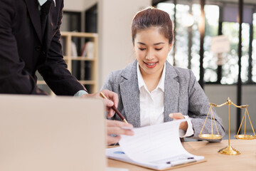 Lawyer with Document Paper and Hammer on Wood table,  Judge's Gavel, Law, Justice Symbol, Agreement and Partnership Concept,