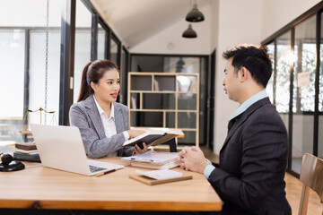 Lawyer with Document Paper and Hammer on Wood table,  Judge's Gavel, Law, Justice Symbol, Agreement and Partnership Concept,