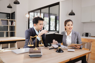 Fototapeta premium Lawyer with Document Paper and Hammer on Wood table, Judge's Gavel, Law, Justice Symbol, Agreement and Partnership Concept,